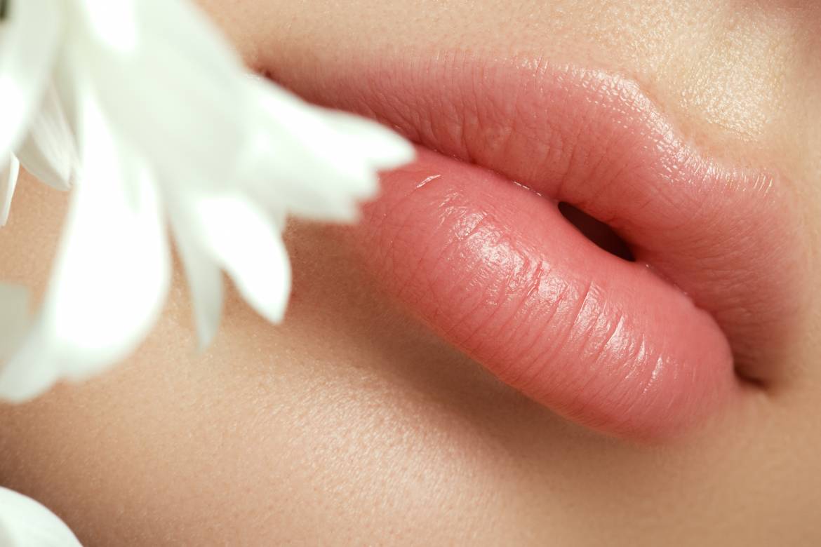bigstock-Lips-With-Flower-Close-up-Bea-141706727.jpg